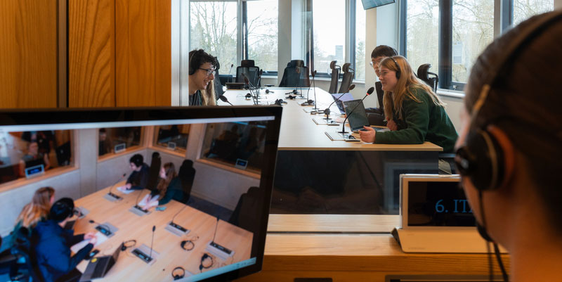 A group of students working in our multilingual conference suite.