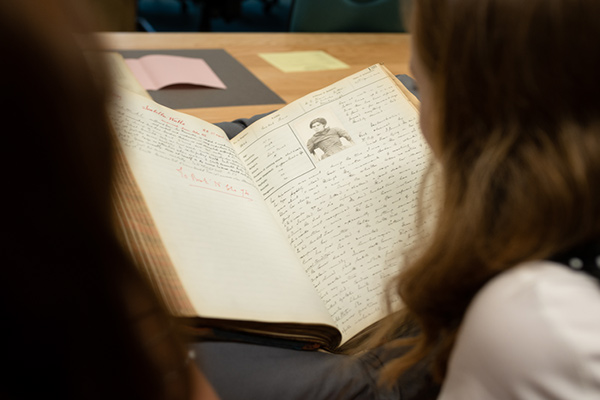 A student reading a book in the Borthwick Archives