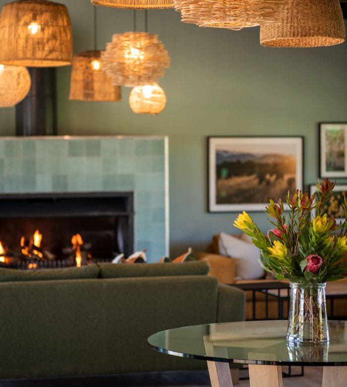 fireplace with flowers on a table
