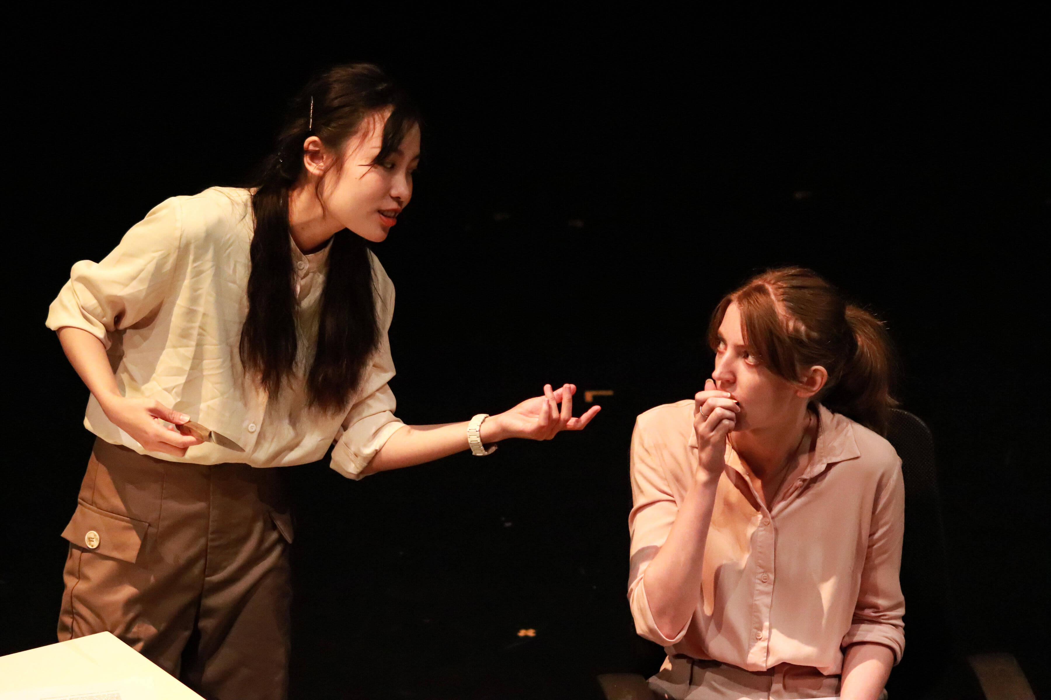 Two students in a theatre performance