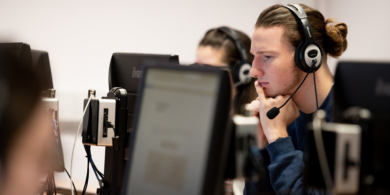 A student working on a computer in the eLab