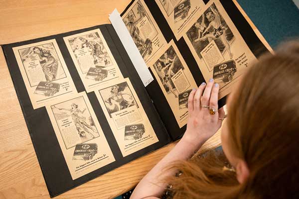 A student studying historical photos