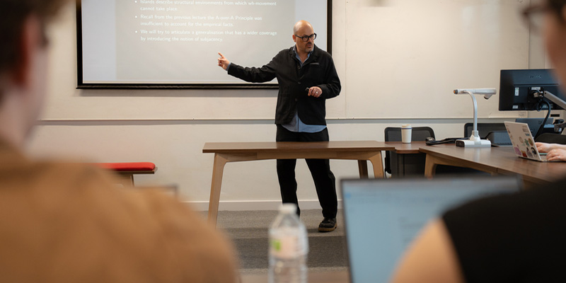 An academic delivering a seminar.