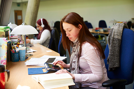 Postgraduate student studying in the Humanities Research Centre.