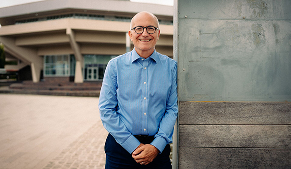 Charlie Jeffrey stood in front of Central Hall on the campus of the University of York